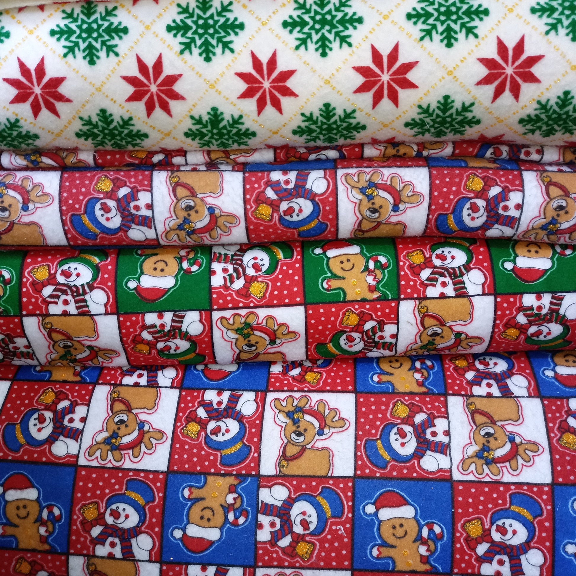 TELA-FLEECE-NAVIDEÑO-DISEÑOS-SURTIDOS